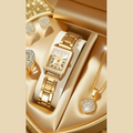 Gold watch and jewelry set in a decorative box