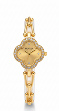 A gold-plated women's watch by Novixa with a white ceramic link band and a clover-shaped dial encrusted with small clear crystals, shown on a white background.