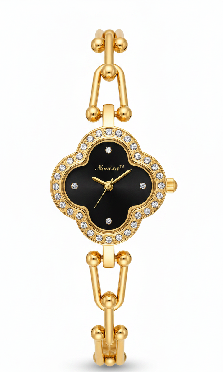A gold-tone women's bracelet watch with a black clover-shaped dial, surrounded by a crystal-studded bezel. The brand name 'NoorZara' is visible on the dial.