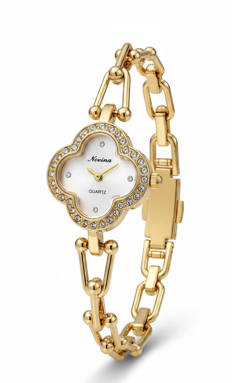A gold-tone bracelet watch with a cloud-shaped white dial and crystal accents, shown on a clean white background.