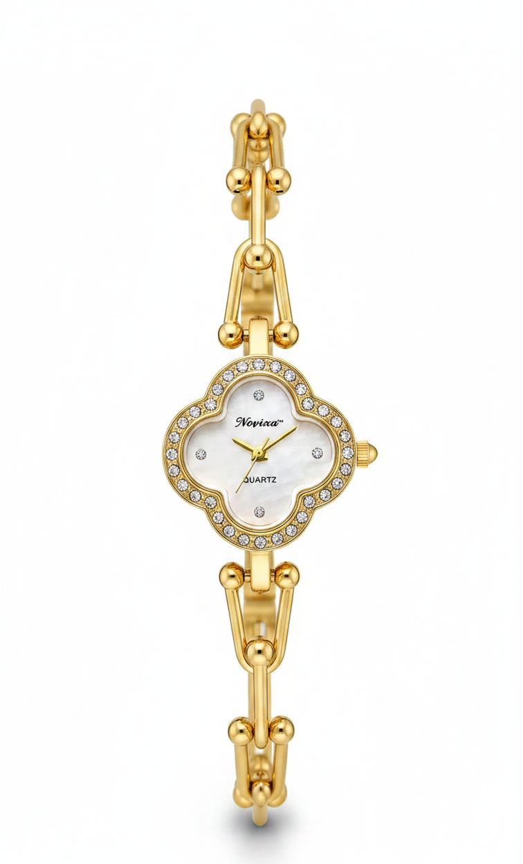 A gold-tone women's watch with a clover-shaped dial, crystal-embellished bezel, and matching gold-tone link bracelet on a white background.