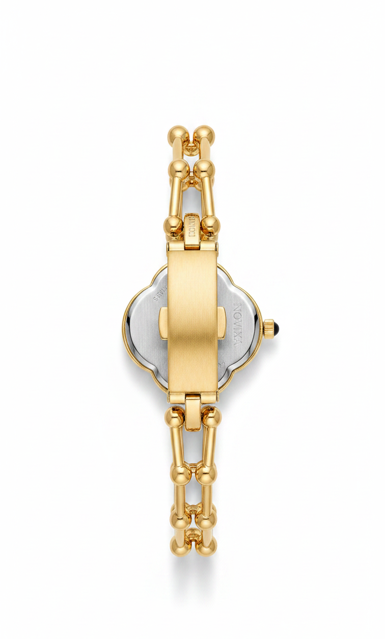 Gold-tone watch band and case back detail on a white background, with a small silver-toned inset visible in the center.