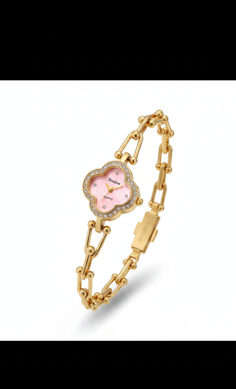 A gold-plated women's bracelet watch with a pink dial and a bezel-set crystal rhinestone halo, displayed on a white background with a soft shadow.