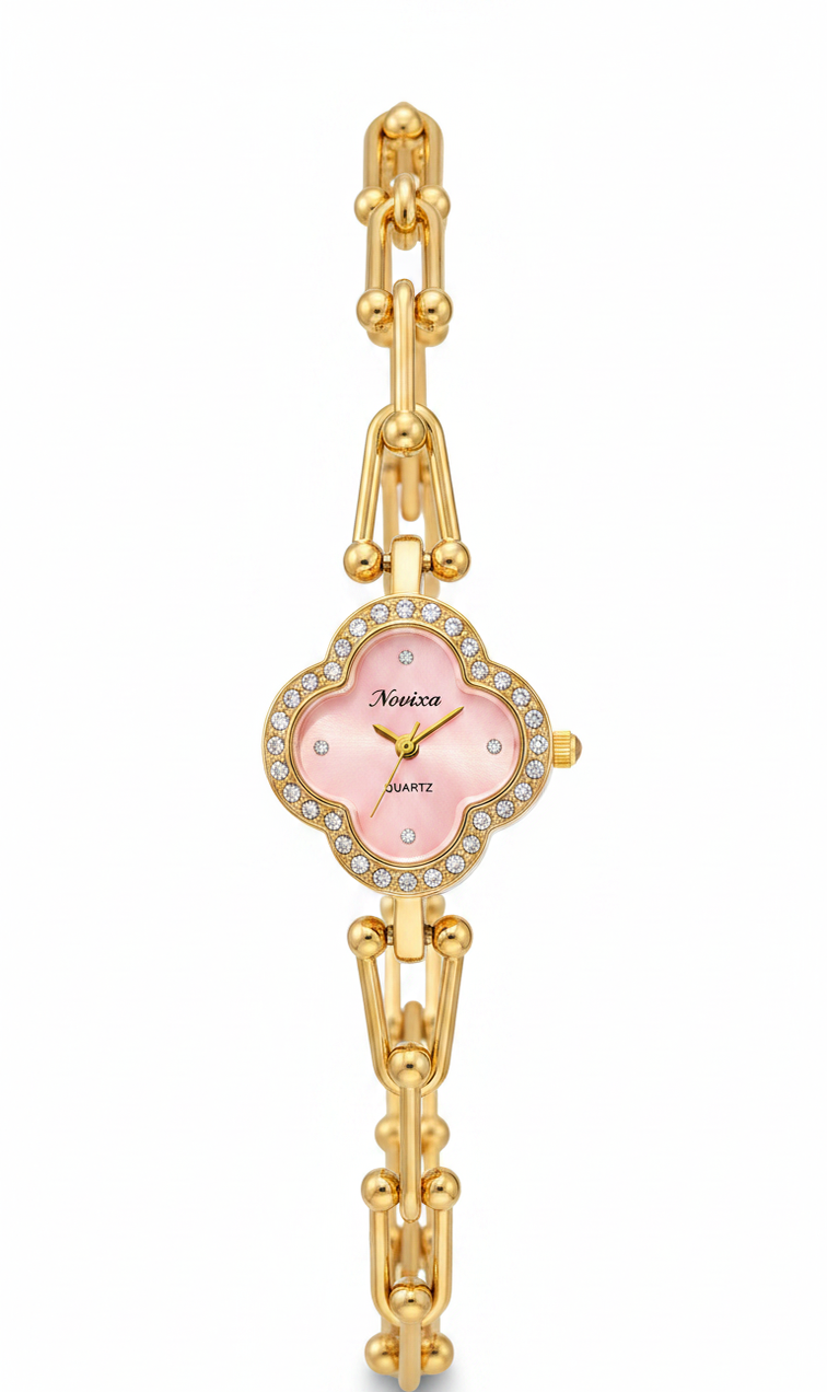 A gold-plated women's link bracelet watch with a scalloped pink dial, crystal-encrusted bezel, and gold-tone hands, shown on a plain white background.